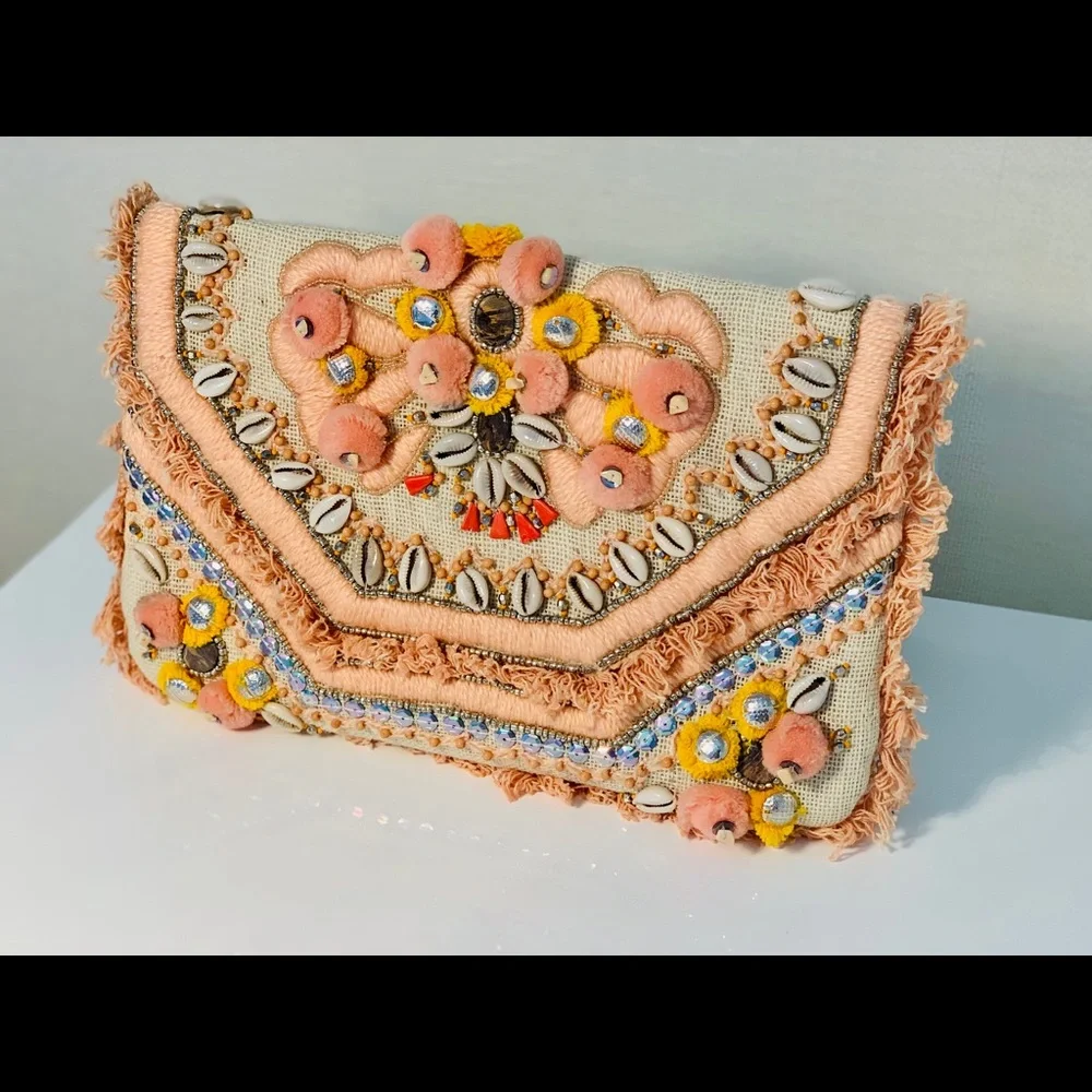 Canvas clutch with coral‎ and yellow pom-poms